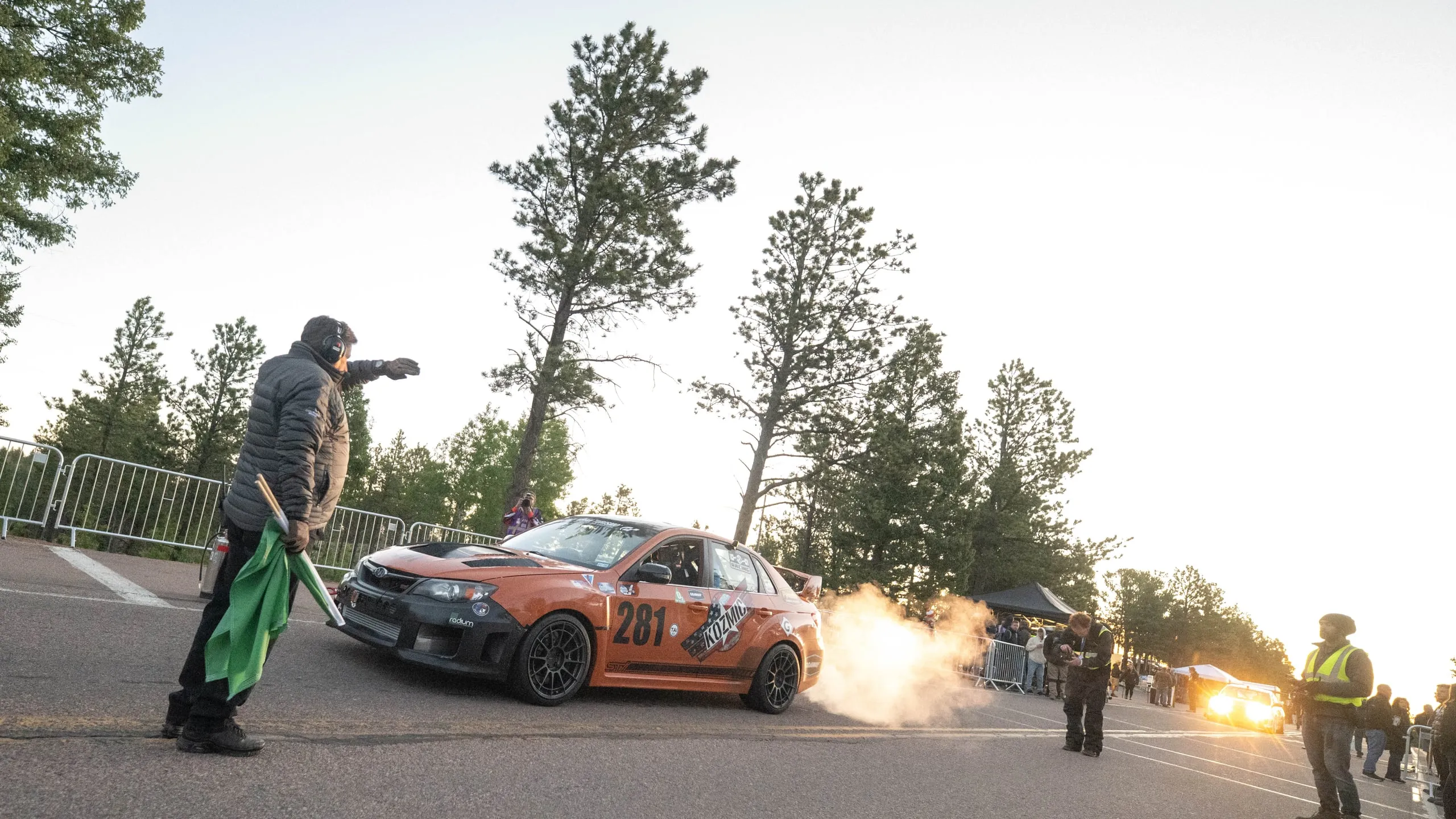 Exhaust flames as #281 accelerates on a practice run at dusk